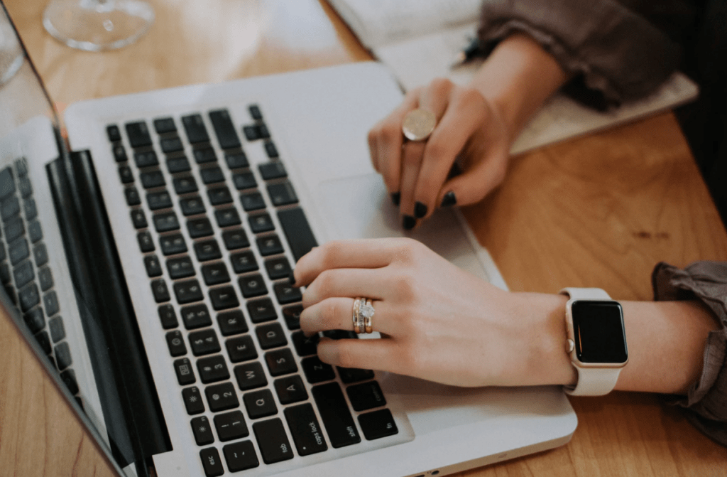 business executive typing on laptop