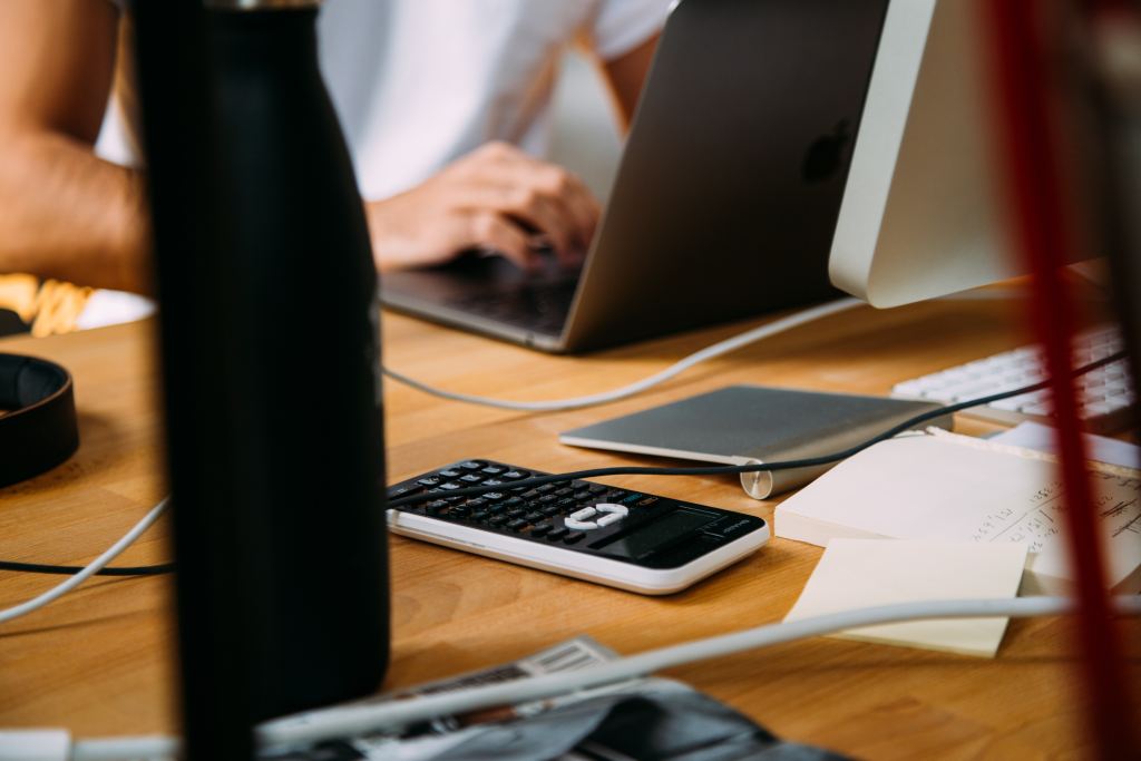 staff accountant laptop calculator working
