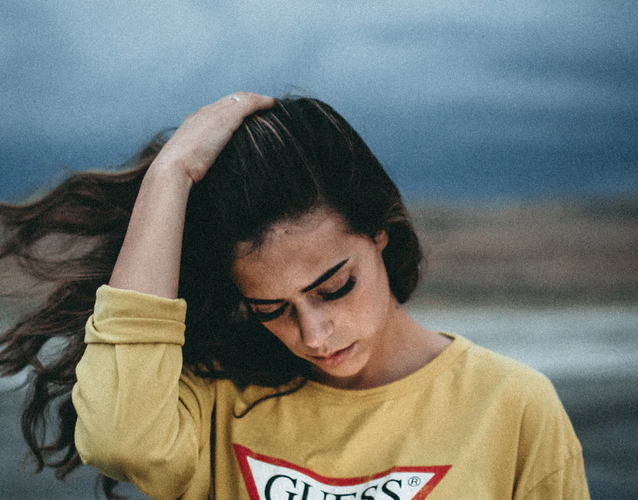 ib program myths, woman wearing yellow shirt, dark sky